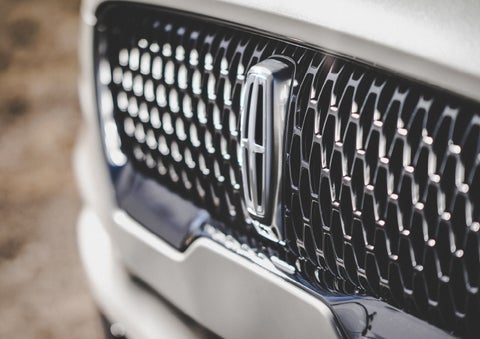 The grille of the 2024 Lincoln Aviator® Reserve model with an eye-catching repeated field of Lincoln Star logo shapes | Griffin Lincoln in Tifton GA