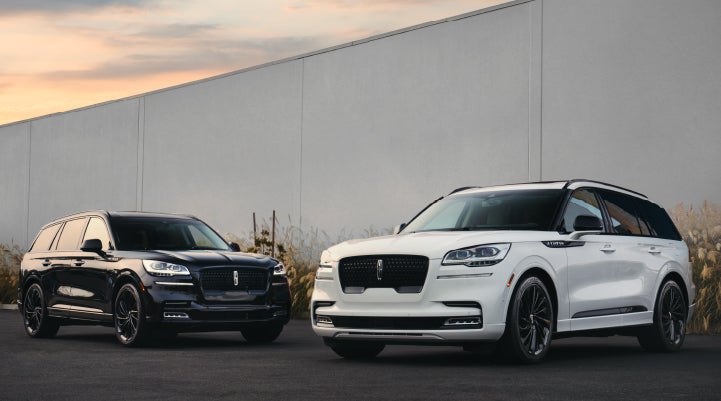 Two Lincoln Aviator® SUVs are shown with the available Jet Appearance Package | Griffin Lincoln in Tifton GA
